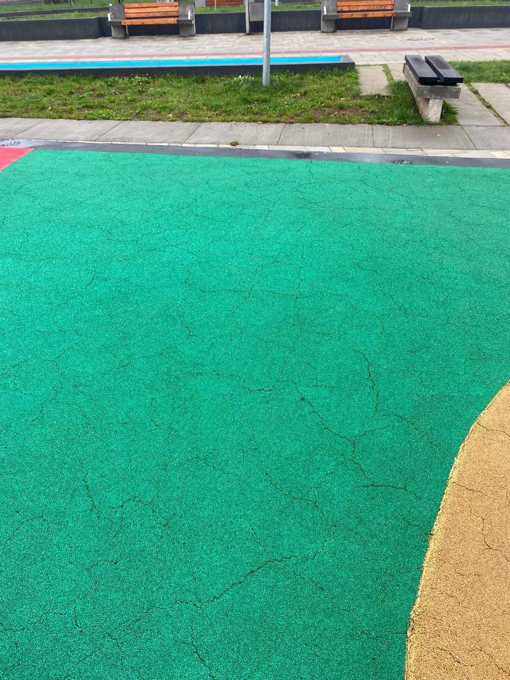 Widespread surface cracking in an EPDM wet-pour surface nine months after installation