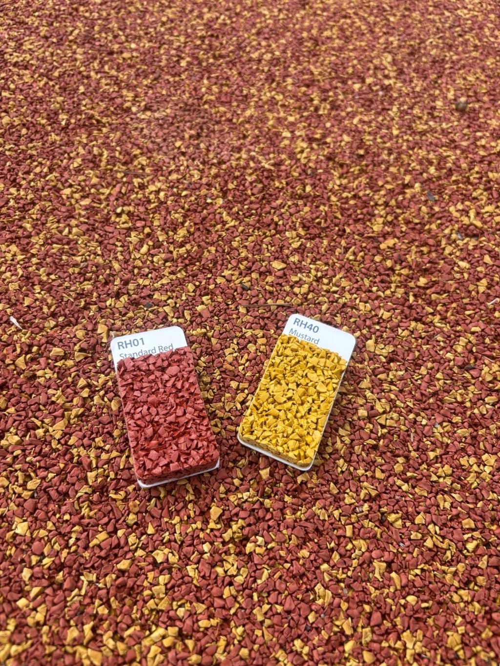 Rosehill TPV surface installed in Sydney in 2018, photographed with the RH01 Red factory swatch card against it