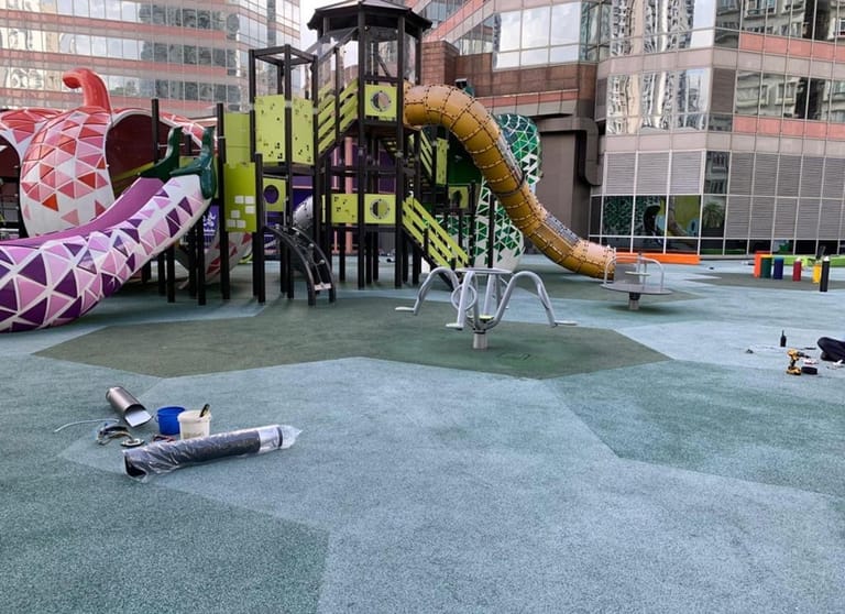 The same EPDM surface twelve months later &mdash; faded, cracking and dusting