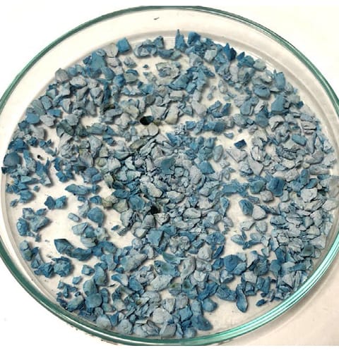 Asian blue EPDM after the same 9,600 kJ EN 14836 dose &mdash; severe fade, greyscale 2