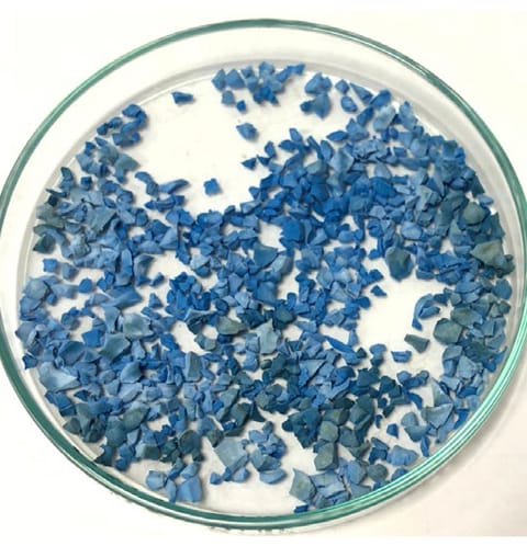 Premium European blue EPDM after the same 9,600 kJ EN 14836 dose &mdash; visible fade, greyscale 3